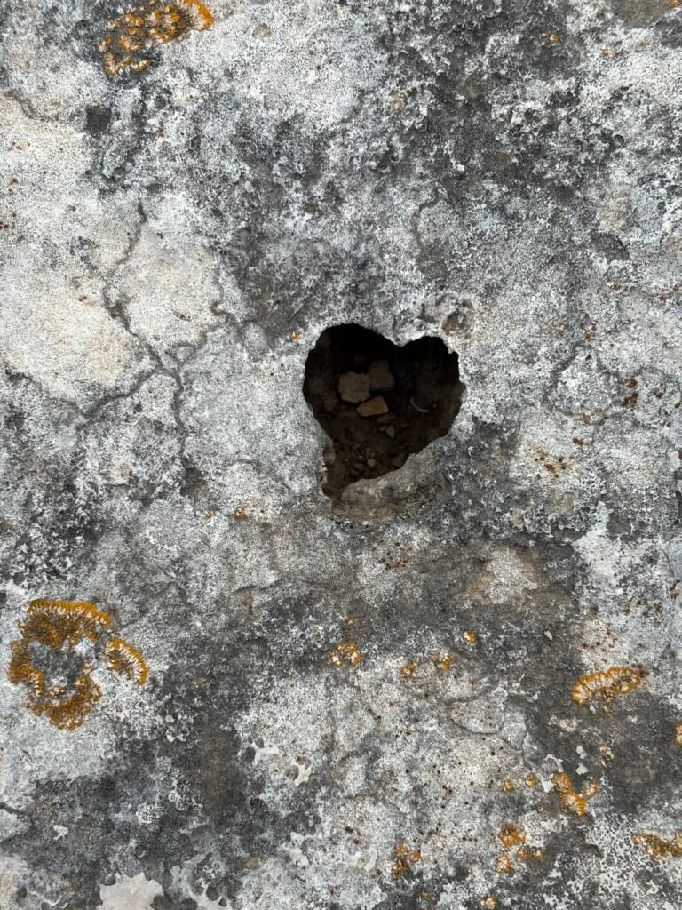 Heart-shaped opening in rock symbolizing self-discovery and inner growth